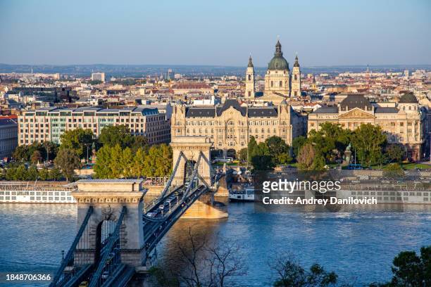 aerial view of budapest, hungary at sunset. - chain bridge suspension bridge stock pictures, royalty-free photos & images
