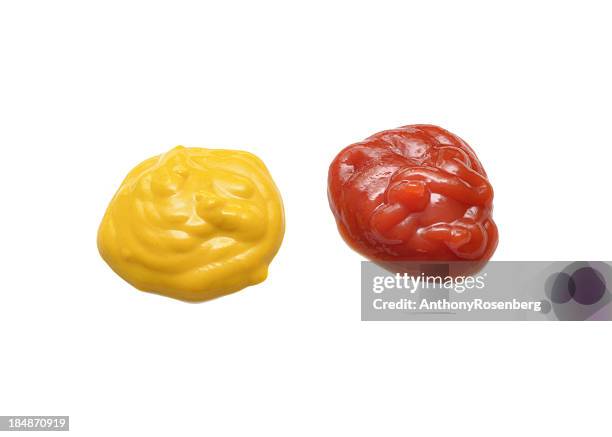 smear of ketchup and mustard on white background - mustard stock pictures, royalty-free photos & images