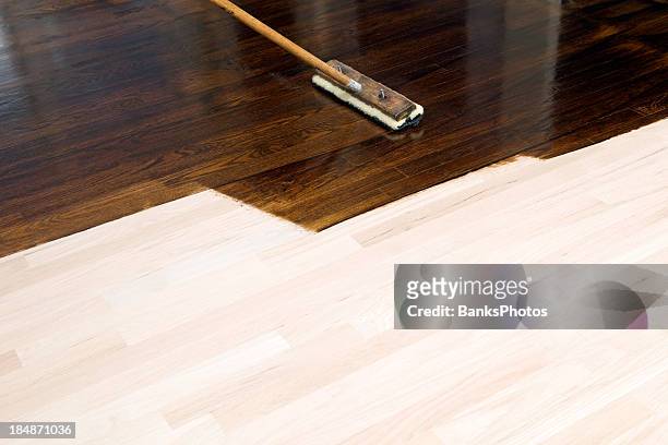 dark stain application on new oak hardwood floor - lövträ bildbanksfoton och bilder
