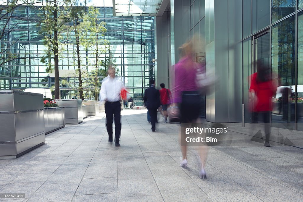 Motion blur photo of people in financial district