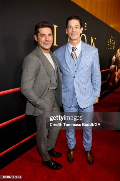 Zac Efron and John Cena attends the Los Angeles Premiere Of A24's "The Iron Claw" at DGA Theater Complex on December 11, 2023 in Los Angeles,...