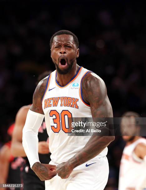Julius Randle of the New York Knicks celebrates scoring against the Toronto Raptors during their game at Madison Square Garden on December 11, 2023...