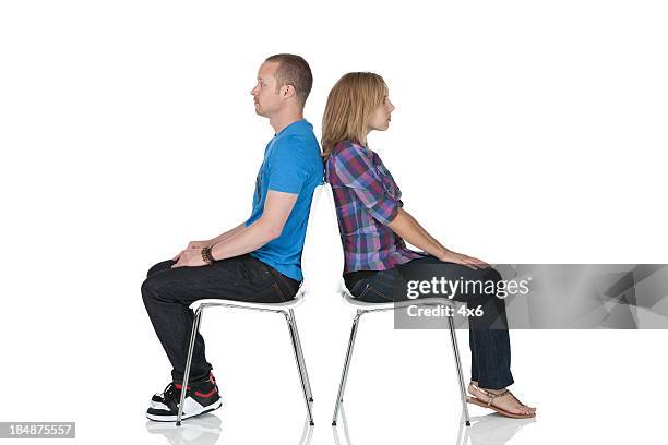 couple crisis - woman sitting on mans lap stockfoto's en -beelden