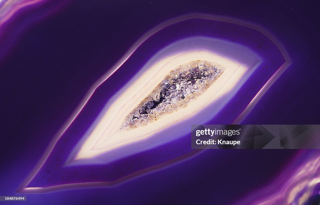 Quartz crystal inside of purple banded agate