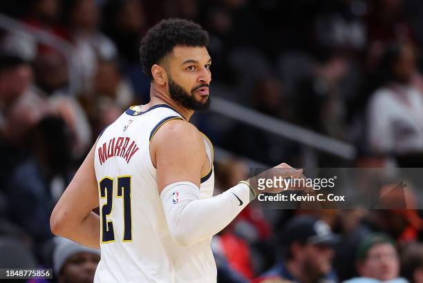 Jamal Murray of the Denver Nuggets reacts after hitting a three-point basket against the Atlanta Hawks during the fourth quarter at State Farm Arena...