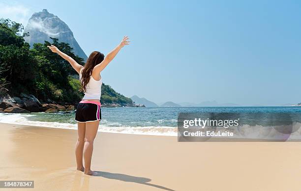 relaxing on the beach - praia vermelha rio de janeiro stock pictures, royalty-free photos & images