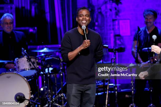 Chris Rock performs onstage during 2023 Night of Too Many Stars benefiting NEXT for AUTISM at Beacon Theatre on December 11, 2023 in New York City.