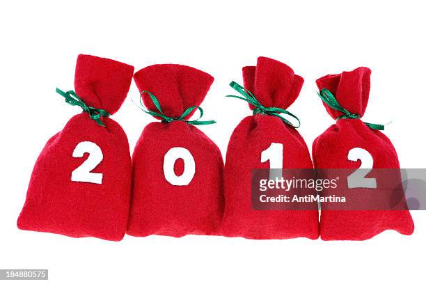 red christmas bags (year 2012) isolated on white - adventkalender stock pictures, royalty-free photos & images