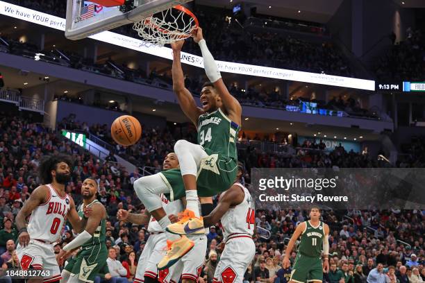 Giannis Antetokounmpo of the Milwaukee Bucks dunks against the Chicago Bulls during the second half of a game at Fiserv Forum on December 11, 2023 in...