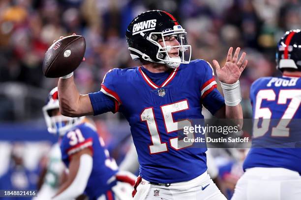 Tommy DeVito of the New York Giants looks to throw a pass against the Green Bay Packers during the third quarter in the game at MetLife Stadium on...