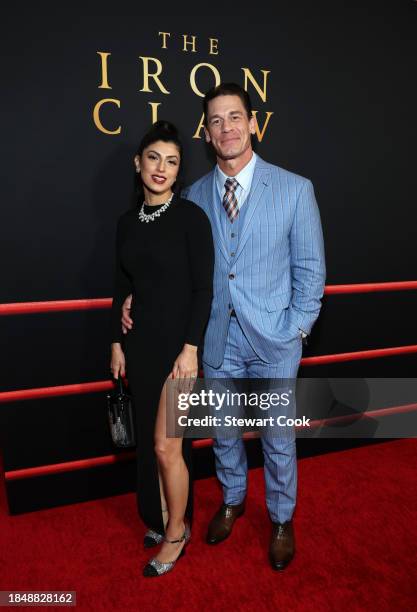 Shay Shariatzadeh and John Cena attend the Los Angeles Premiere of A24's "The Iron Claw" at Directors Guild Of America on December 11, 2023 in Los...