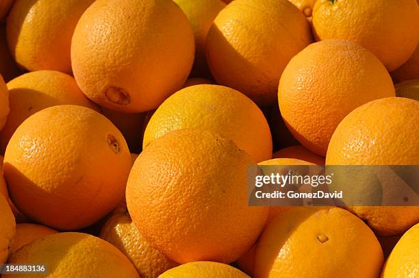 navel oranges in shipping crate - navel orange stock pictures, royalty-free photos & images