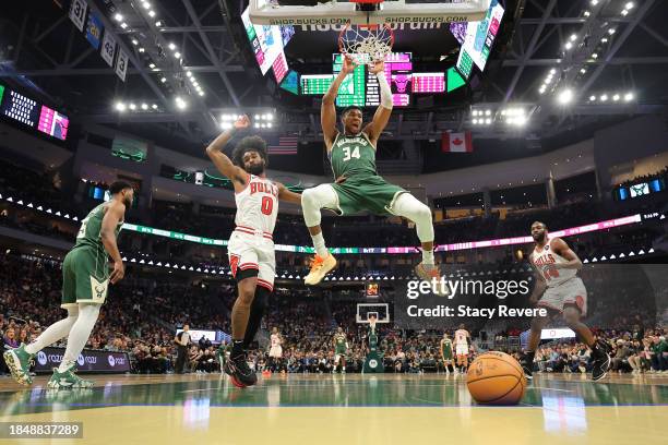 Giannis Antetokounmpo of the Milwaukee Bucks dunks against the Chicago Bulls during the first half of a game at Fiserv Forum on December 11, 2023 in...