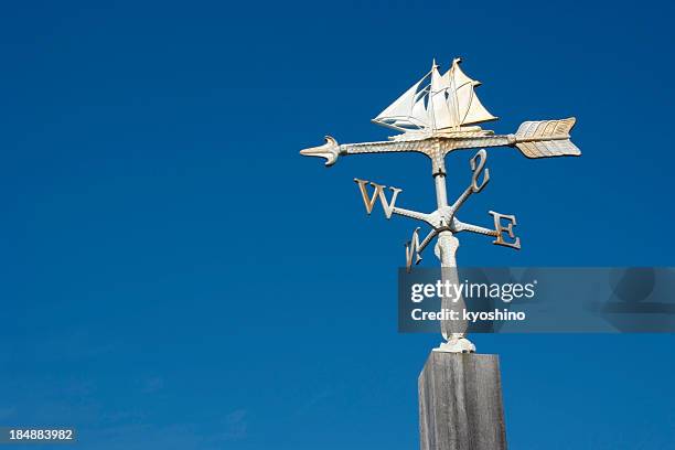 sailboat wind vane against clear sky with copy space - weather vane stock pictures, royalty-free photos & images