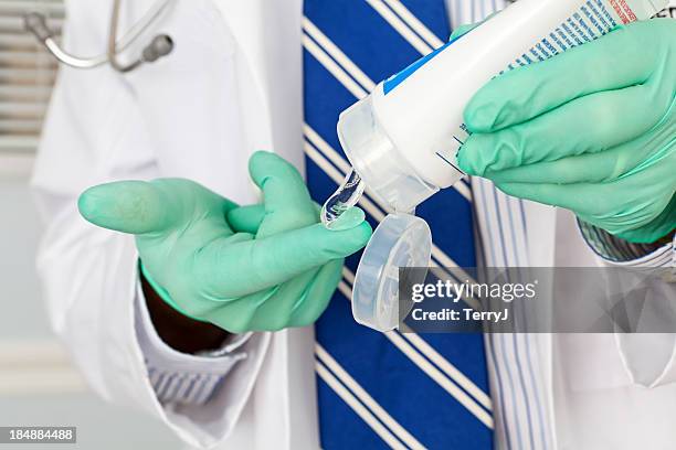 lubrication - surgical glove stock pictures, royalty-free photos & images