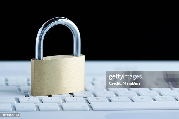 Padlock In Computer Padlock On White Computer Keyboard High-Res Stock Photo - Getty Images