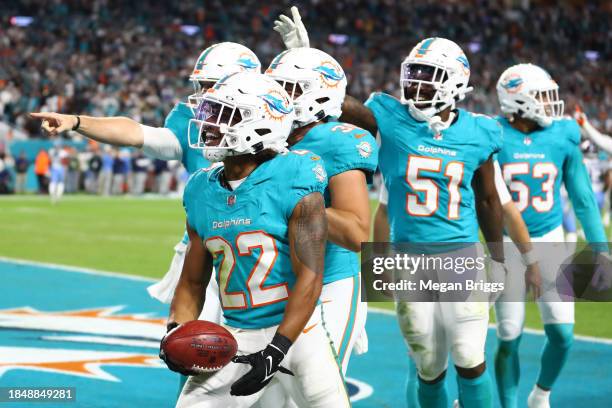 Elijah Campbell of the Miami Dolphins celebrates with teammates after a muffed punt recovery against the Tennessee Titans at Hard Rock Stadium on...