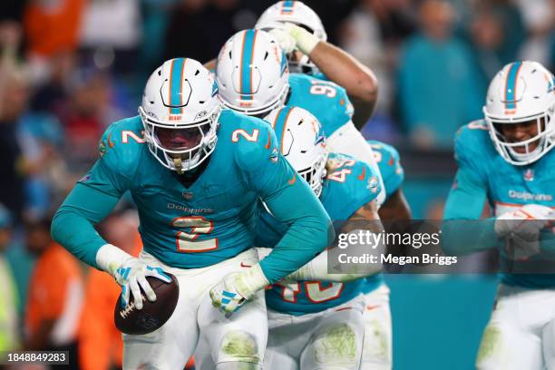 Bradley Chubb of the Miami Dolphins celebrates with teammates after a fumble recovery in the fourth quarter at Hard Rock Stadium on December 11, 2023...