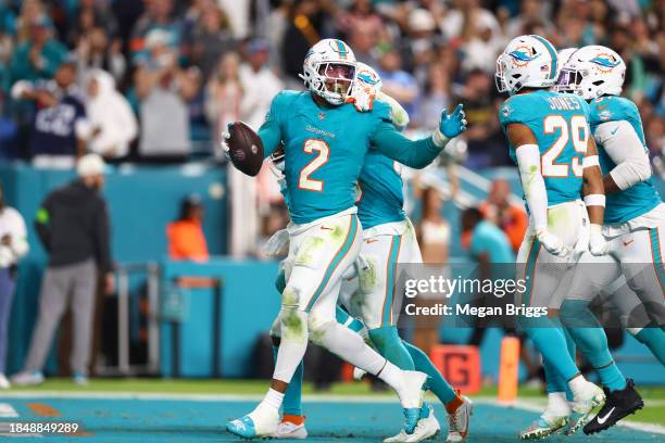 Bradley Chubb of the Miami Dolphins celebrates with teammates after a fumble recovery in the fourth quarter at Hard Rock Stadium on December 11, 2023...