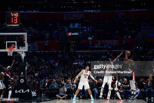 Jabari Walker of the Portland Trail Blazers makes a three-point shot against the LA Clippers in the first half at Crypto.com Arena on December 11,...