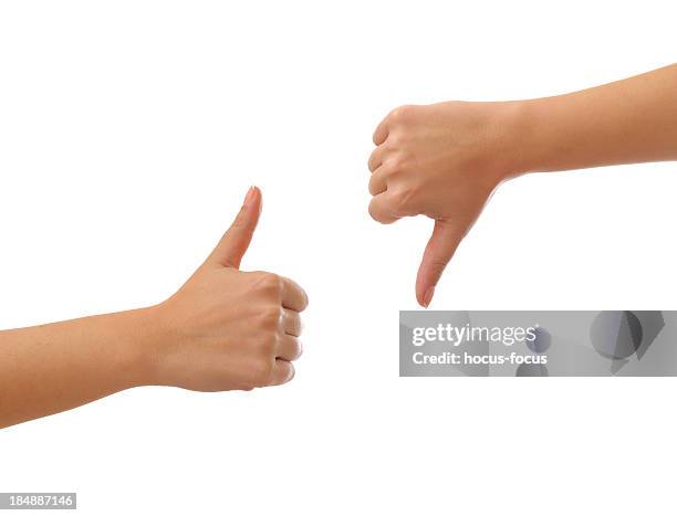 thumbs up and  down - thumbs up stockfoto's en -beelden