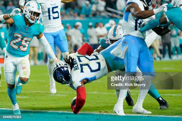 Derrick Henry of the Tennessee Titans runs for a touchdown in the fourth quarter against the Miami Dolphins at Hard Rock Stadium on December 11, 2023...