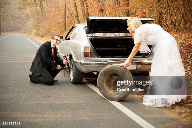 unexpected problems on the honeymoon. just married series - bride and groom wedding car stock pictures, royalty-free photos & images