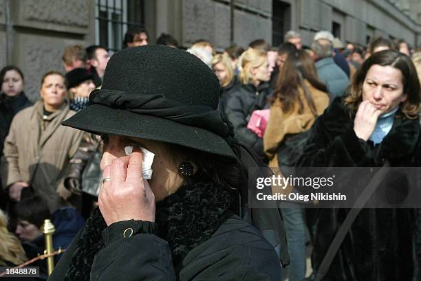 Mourner wipes her face as she mourns the death of Serbian Prime Minister Zoran Djindjic in front of a government building March 14, 2003 in the...