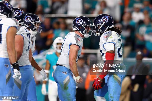 Will Levis and Derrick Henry of the Tennessee Titans celebrate after a touchdown in the fourth quarter at Hard Rock Stadium on December 11, 2023 in...