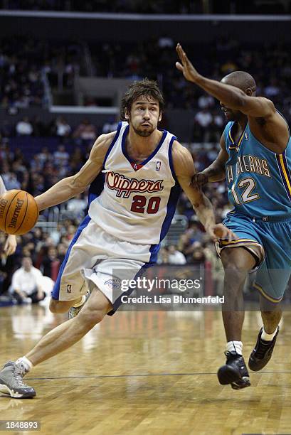 Marko Jaric of the Los Angeles Clippers drives to the basket under pressure from Kenny Anderson of the New Orleans Hornets on March 3, 2003 at...