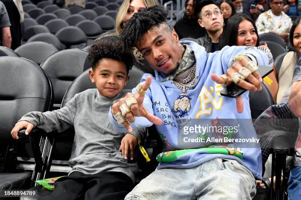 Rapper Blueface and his son Javaughn J. Porter attend a basketball game between the Los Angeles Clippers and Portland Trail Blazers at Crypto.com...