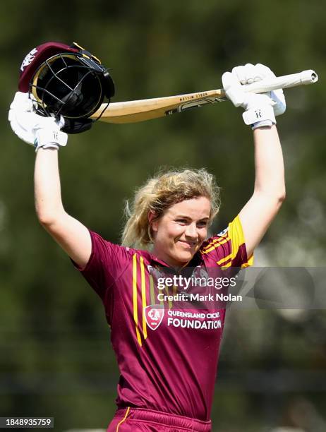Georgia Redmayne of Queensland celebrates her century during the WNCL match between ACT and Queensland at EPC Solar Park, on December 12 in Canberra,...