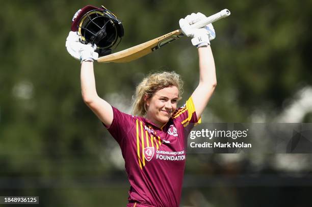 Georgia Redmayne of Queensland celebrates her century during the WNCL match between ACT and Queensland at EPC Solar Park, on December 12 in Canberra,...