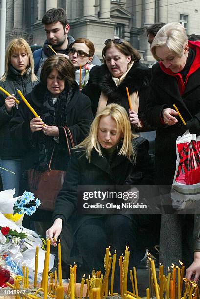 People light candles in front of a government building for assassinated Serbian Prime Minister Zoran Djindjic March 14, 2003 in the Serbian capitol...