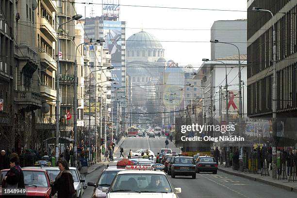 St. Sava Cathedral is shown in the background as cars travel along a street March 14, 2003 in the Serbian capitol of Belgrade. Religious Patriarch...