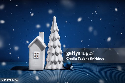 White Ceramic House And Christmas Tree On Lights Night Background High ...