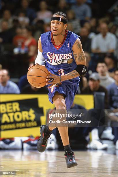 Allen Iverson of the Philadelphia 76ers moves the ball up court during the game against the Denver Nuggets at Pepsi Center on March 2, 2003 in...
