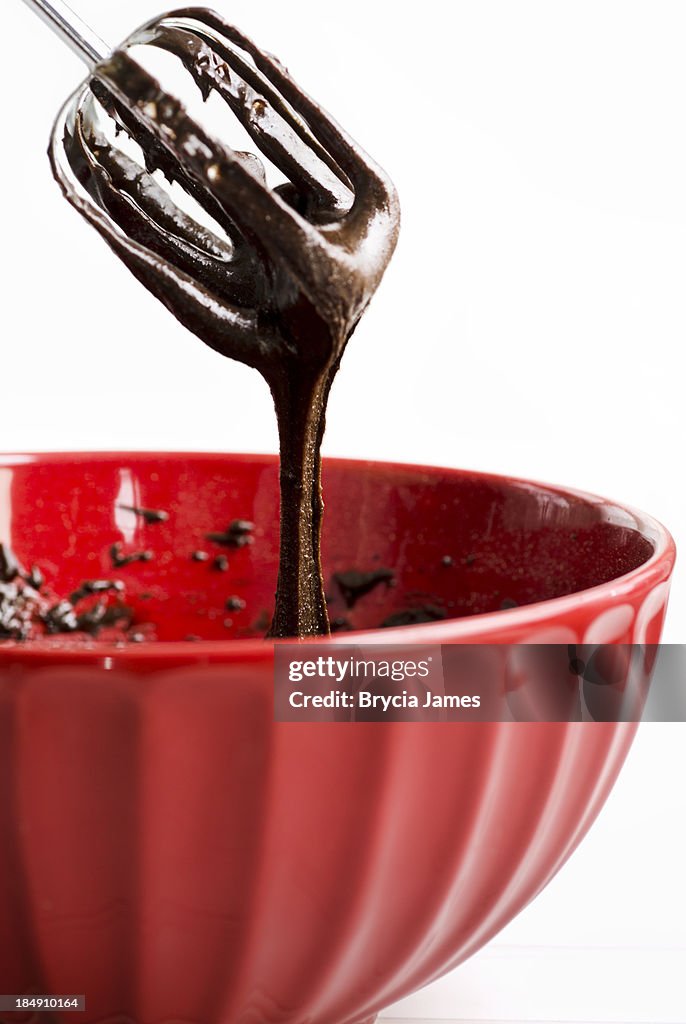 Mixing Brownie Batter in a Red Bowl with Copy Space