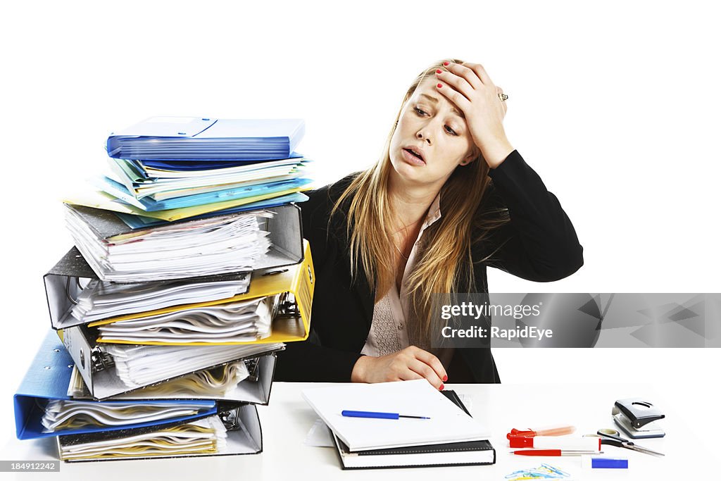 Work is such a headache: unhappy overworked young businesswoman