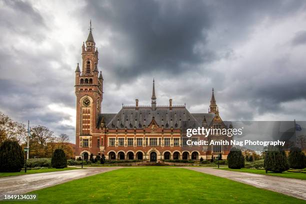 the peace palace in the hague, the netherlands - international court of justice stock pictures, royalty-free photos & images