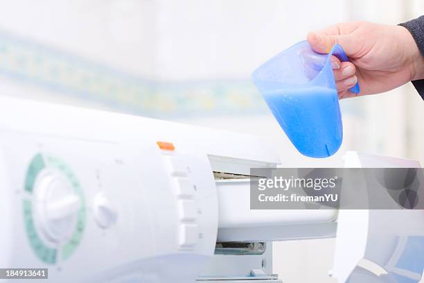 pouring softerner for loundry - cleaning agent stock pictures, royalty-free photos & images