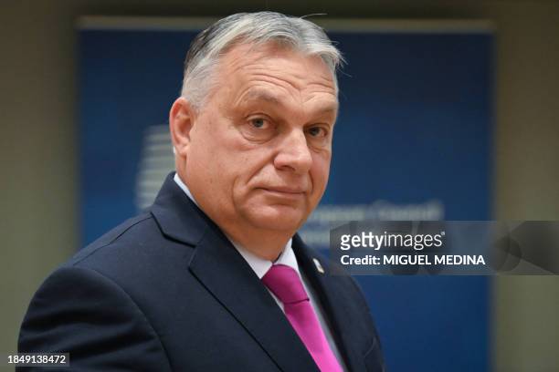 Hungary's Prime Minister Viktor Orban arrives to attend a roundtable meeting of the European Council at the European headquarters in Brussels, on...