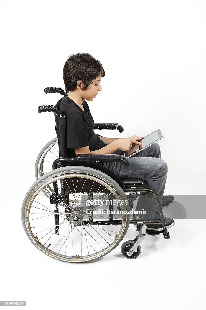 Boy With Led Disability Disabled Young Boy Looking At Digital Tablet High-Res Stock Photo ...