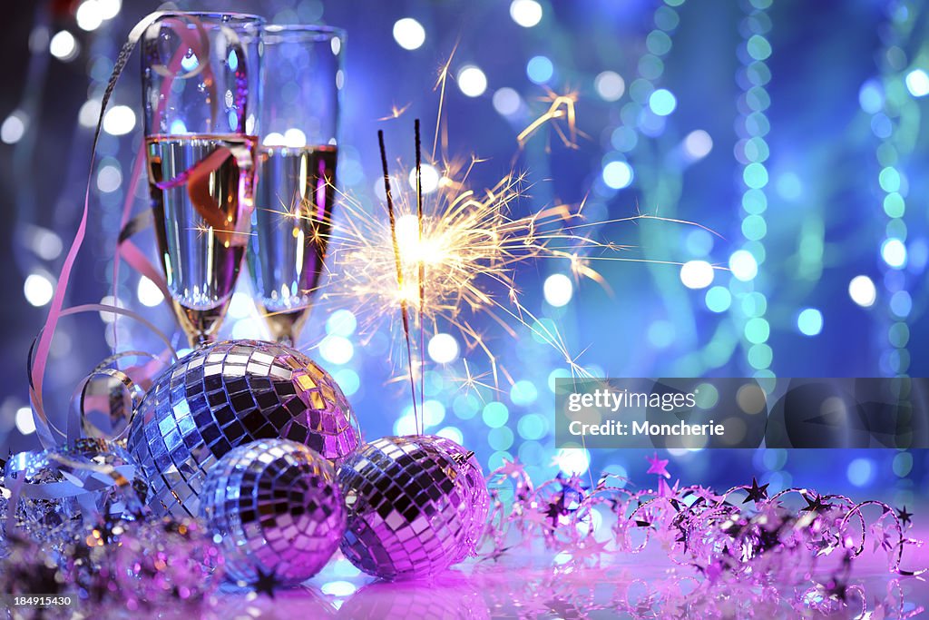 Party decoration with disco balls and fire sparkler