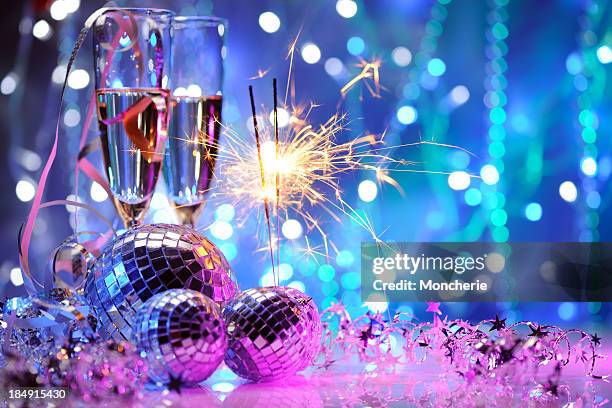 party decoration with disco balls and fire sparkler - champagne popping stock pictures, royalty-free photos & images