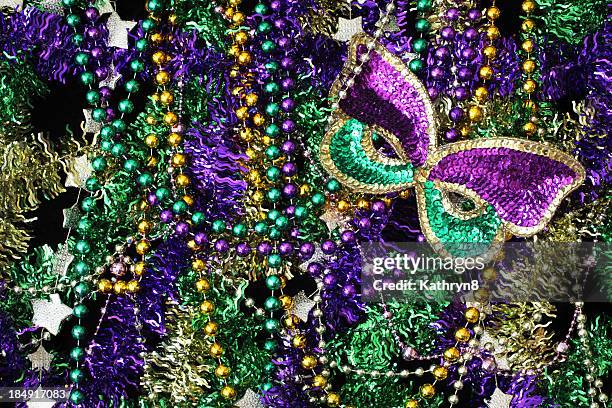 beads and mask background - mardi gras beads stock pictures, royalty-free photos & images