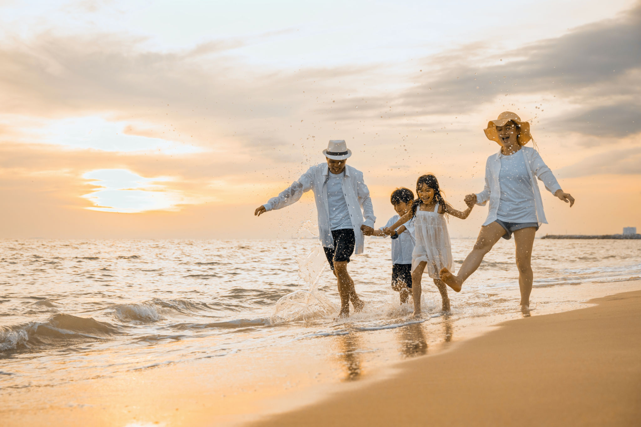 family enjoying beach