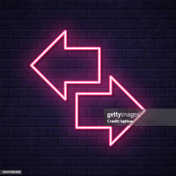 transfer arrows. glowing neon icon on brick wall background - visa accepted here stock illustrations
