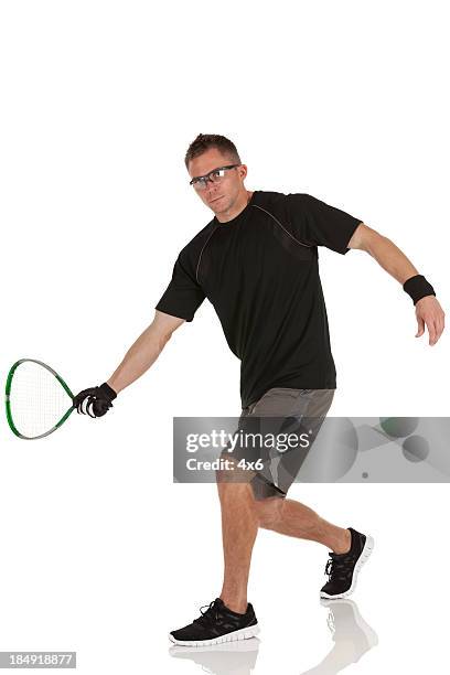 man playing racquetball - squash game stock pictures, royalty-free photos & images