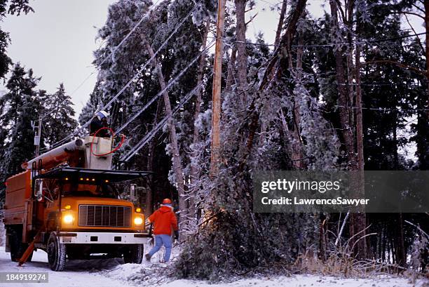 power company winter storm repairs - ice storm stock pictures, royalty-free photos & images